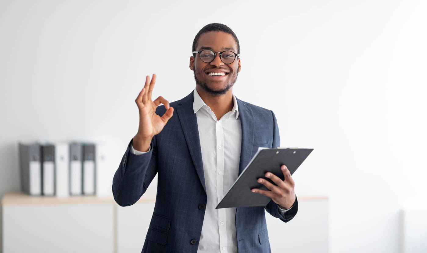 A man holding a clipboard - learn more about our ideal candidate for our tax franchise opportunities.